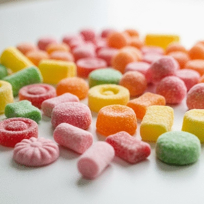 Assortment of vibrant freeze-dried candies on a light background